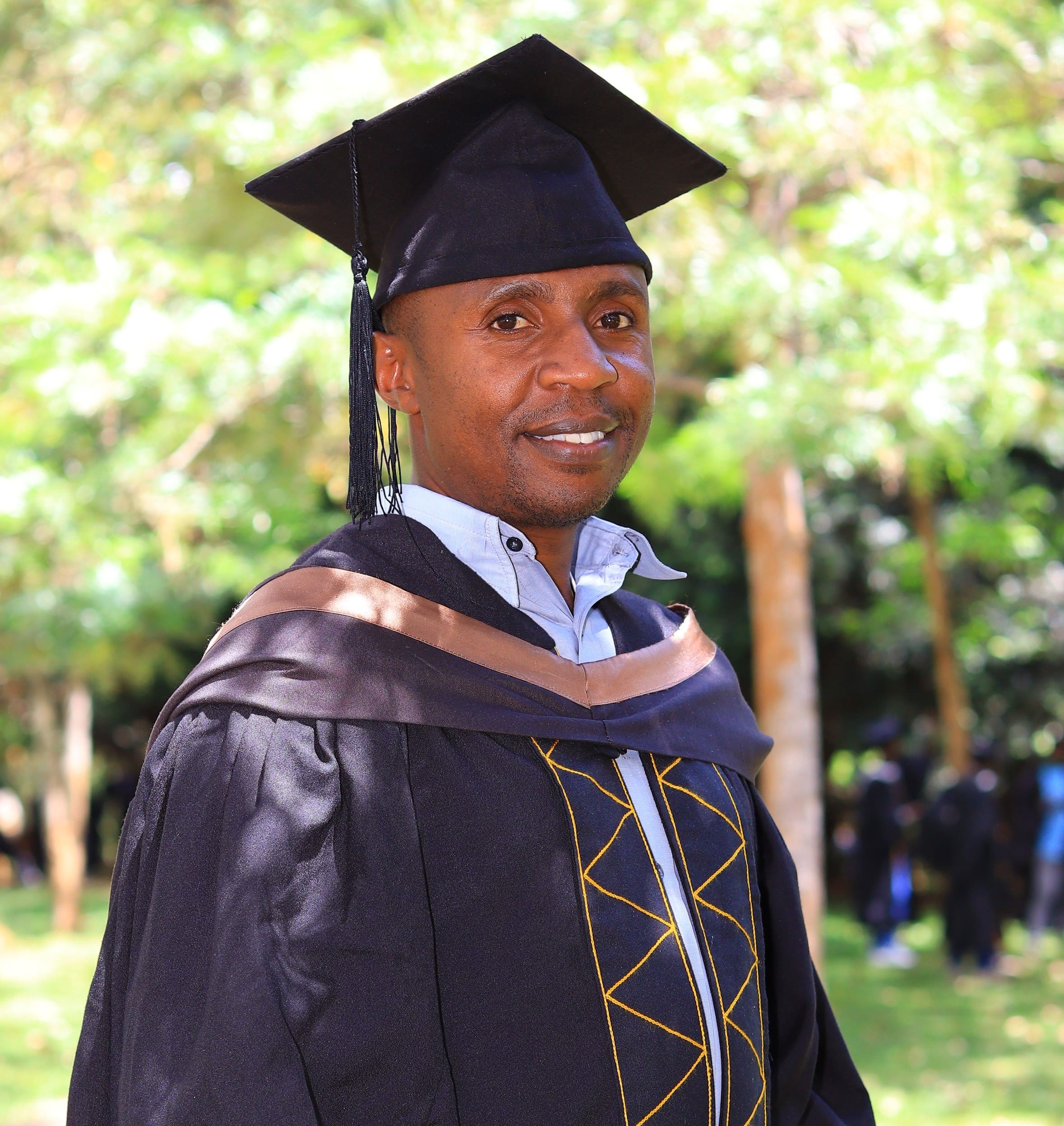 Kelvin Mwangi Kamau in graduation gown at Kenyatta University