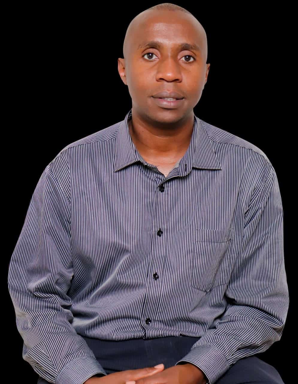 Kelvin Kamau professional portrait in striped shirt