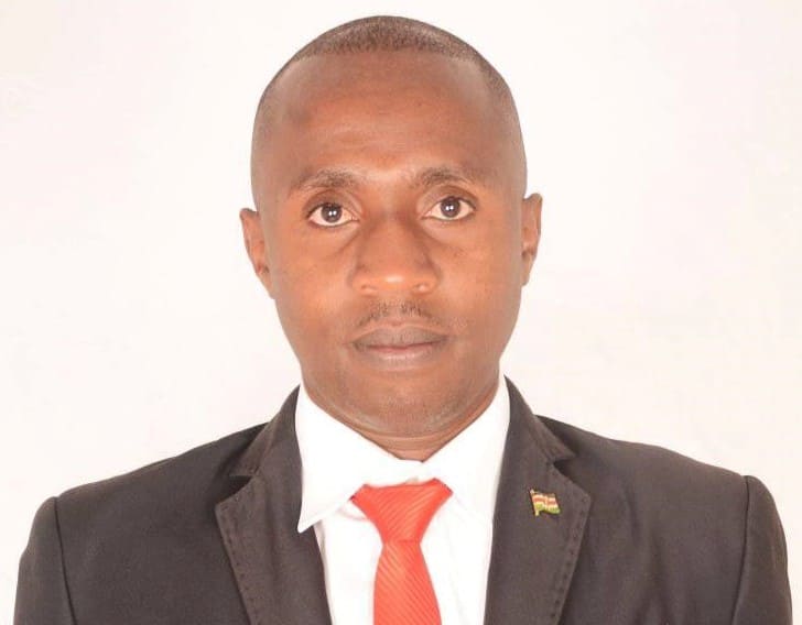Kelvin Mwangi Kamau in suit and red tie
